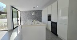 MODERNA CASA ADOSADA EN PORTOCOLOM 719.800 €